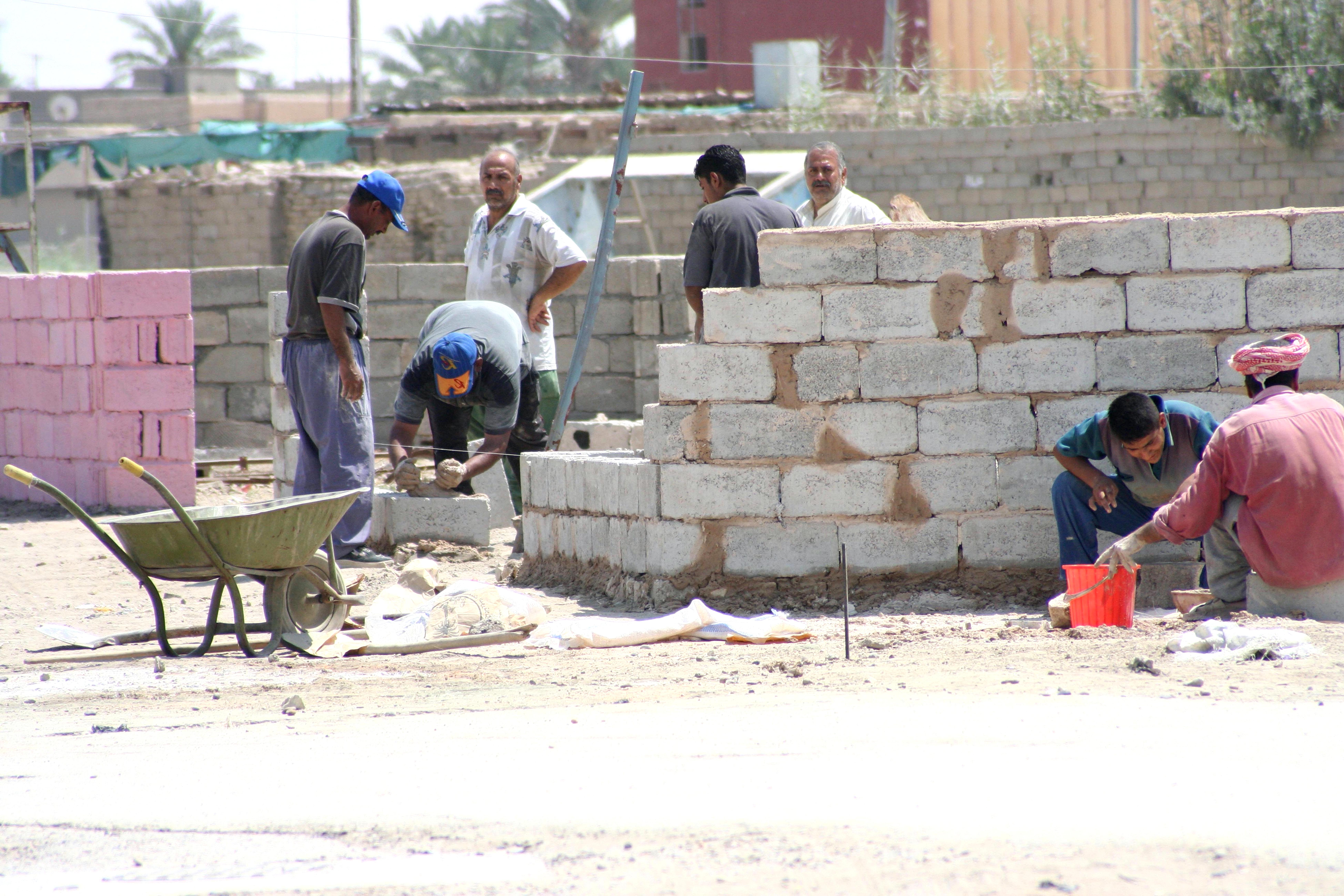 Workers rebuilding ramadi town iraq